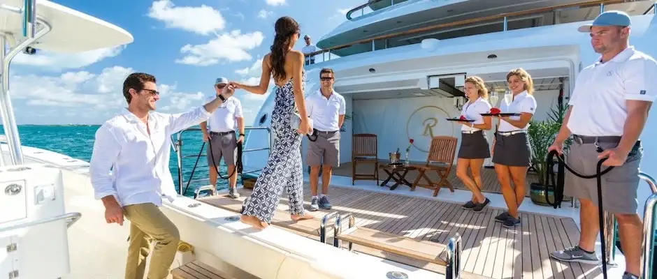 Crew welcoming Yacht Charter guests on Board of a Superyacht