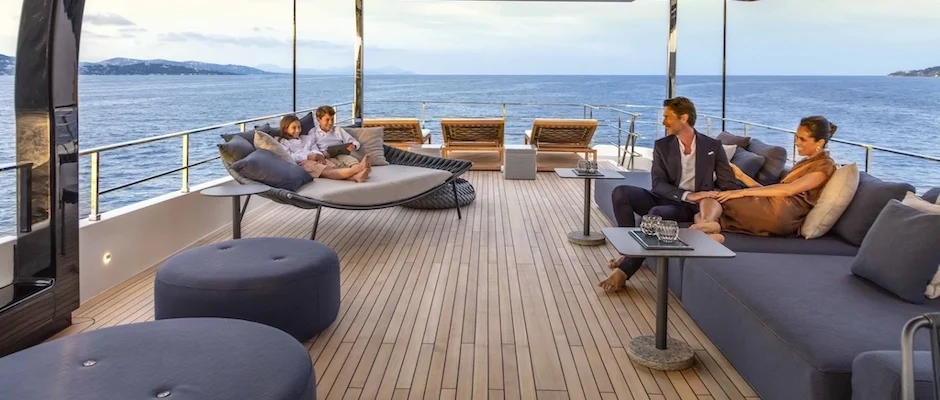 Family enjoying afternoon on deck of a yacht