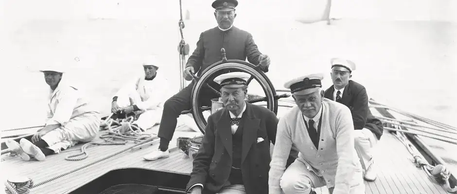 Sir Thomas Lipton on the helm of one of his SHAMROCKS