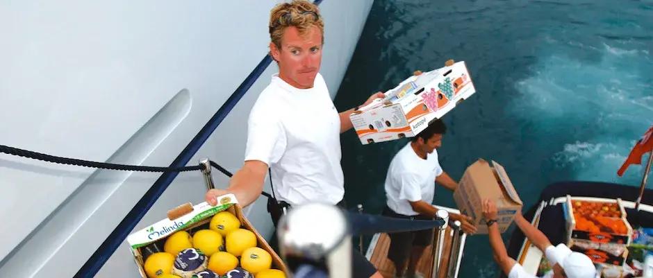 Crew member is provisioning a yacht