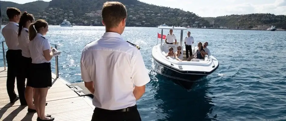 speedboat docks on a charter yacht with guests